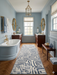 2.8' x 8' runner ivory & gray geometric maze modern area rug placed in a bright bathroom with dual vanities and elegant fixtures.
