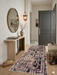 2.8' x 8' runner taupe & brown geometric maze modern area rug styled in an entryway with a console table, round mirror, and warm lighting.