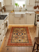 2' x 3' Rectangular Beige Rust Floral Medallion Traditional Area Rug styled in a bright farmhouse kitchen in front of a white apron sink with warm wood flooring.