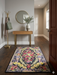 2' x 3' Rectangular Black & Multicolor Floral Medallion Vintage Traditional Area Rug styled in a modern entryway.