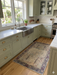 2' x 3' Rectangular Ivory & Blue Geometric Tribal Traditional Area Rug styled in a bright farmhouse kitchen.