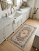 2' x 3' Rectangular Ivory Multi Color Floral Medallion Traditional Area Rug styled in a kitchen.