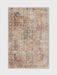 6' x 9' Rectangular Rust Pink Southwestern Tribal Geometric Area Rug featured in a living room with a sofa, coffee table, and brick fireplace backdrop.
