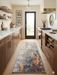 2' x 4' Rectangular Gray Gold Abstract Modern Washable Area Rug styled in a modern kitchen with walnut cabinets, marble countertops, and a glass back door.