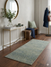 2' x 4' Rectangular Green Sage Distressed Modern Abstract Area Rug styled in a modern entryway with console table, bench, and wall mirror.