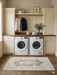 2' x 4' Runner Gray & Ivory Distressed Medallion Traditional Washable Area Rug styled in a laundry room with cabinetry and appliances.