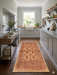 2' x 5' Runner Brown & Beige Tribal Geometric Traditional Area Rug styled in a kitchen with cabinetry and open shelving.
