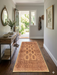 2' x 5' Runner Brown & Beige Tribal Geometric Traditional Area Rug styled in an entryway hallway with a console table and wall decor.