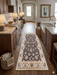 2' x 5' Runner Charcoal & Ivory Floral Traditional Washable Area Rug styled in a warm farmhouse kitchen between wooden cabinets.