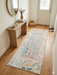 2' x 5' Runner Ivory Blue Distressed Tribal Modern Washable Area Rug placed in a bright entryway with a natural wood bench and round wall mirror.