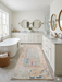 2' x 5' Runner Ivory Blue Distressed Tribal Modern Washable Area Rug placed in a spacious bathroom with double vanities and a freestanding soaking tub.