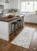 2' x 5' Runner Ivory Gray Tribal Geometric Southwestern Area Rug placed in a bright farmhouse kitchen with a white island and warm wood floors.