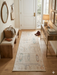 2' x 5' Runner Ivory & Multicolor Distressed Tribal Modern Washable Area Rug styled in a bright entryway beside a wooden bench and console table.