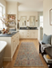 2' x 5' Runner Sage Green & Blush Floral Traditional Washable Area Rug styled in a bathroom with double vanities, warm finishes, and spa-inspired accents.