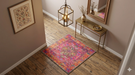 3' x 3' Square Pink & Multicolor Distressed Medallion Bohemian Washable Area Rug placed in a stylish entryway beneath a brass console table.