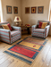 3' x 5' Rectangular Gold & Red Geometric Southwestern Area Rug styled in a cozy Southwestern sitting area.