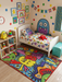 3' x 5' rectangular multicolor cartoon abstract kids playful area rug styled in a colorful kids bedroom with playful wall art and toys.