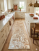 3' x 8' Runner Beige & Ivory Geometric Abstract Modern Washable Area Rug styled in a warm contemporary kitchen with cream cabinetry, brass accents, and natural wood flooring.