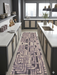 3' x 8' Runner Gray & Taupe Geometric Abstract Modern Washable Area Rug styled in a contemporary kitchen with gray cabinetry, white countertops, brass accents, and modern décor.