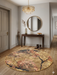 4' Round Beige Pink Abstract Floral Modern Washable Area Rug placed in an elegant entryway beneath a console table and round mirror.