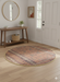 4' Round Rust & Beige Geometric Traditional Area Rug styled in an entryway.