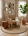 4 ft Round Natural Beige & Brown Woven Solid Modern Farmhouse Washable Area Rug styled in a cozy reading nook.