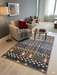 4' x 6' Rectangular Blue & Red Stars Striped Patriotic Area Rug styled in a cozy living room.