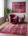 4' x 6' Rectangular Fuchsia Pink Distressed Abstract Modern Area Rug styled in a contemporary sitting area with bold pink accents.