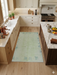 4' x 6' Rectangular Mint Green & Blue Gray Abstract Modern Area Rug placed in a bright kitchen between cabinets and island.