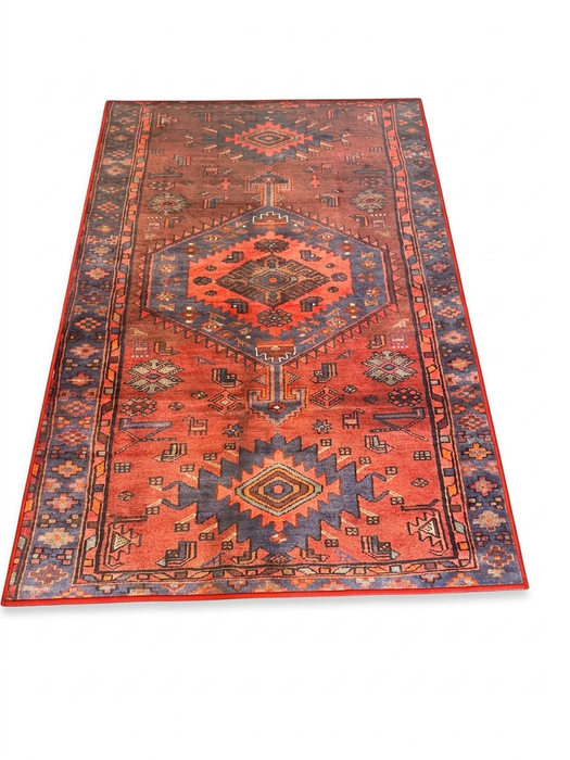 4' x 6' Rectangular Rust Red & Blue Tribal Geometric Medallion Traditional Area Rug isolated on a white background.