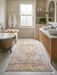 4' x 6' rectangular ivory multicolor distressed floral medallion traditional area rug styled in a bright bathroom with a freestanding tub and double vanity.