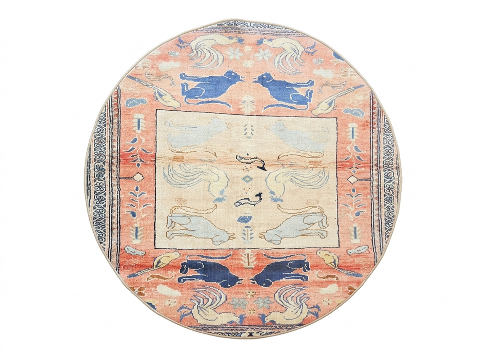 5' Round Peach & Blue Animal Motif Traditional Area Rug isolated on a white background.