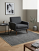 5' x 5' Square Gray & Light Gray Striped Modern Minimalist Washable Area Rug styled in a contemporary living room corner.