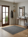 5' x 5' Square Gray & Light Gray Striped Modern Minimalist Washable Area Rug styled in a modern entryway.