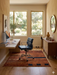 5' x 5' Square Rust & Black Abstract Geometric Modern Area Rug featured in a modern home office with a sleek wooden desk and blue office chair.