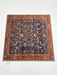 5' x 5' square navy blue & red floral medallion traditional area rug isolated on a white background.