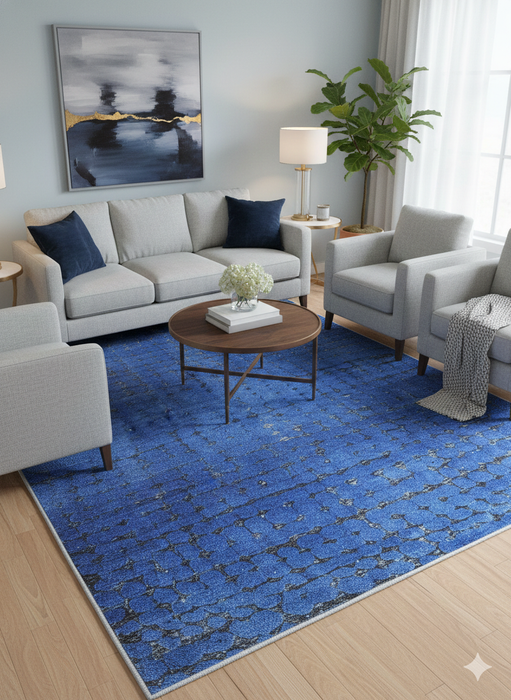 5' x 7' Rectangle Blue & Charcoal Abstract Modern Area Rug styled in a contemporary living room.