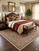 5' x 7' Rectangular Beige & Brown Floral Traditional Washable Area Rug placed in a classic bedroom beneath a wooden bed.