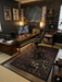 5' x 7' Rectangular Black & Gold Dragon Graphic Oriental Modern Washable Area Rug styled in a gaming or home office with a modern desk setup and Asian-inspired decor.