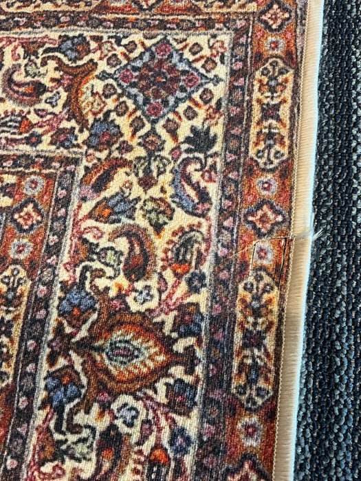 5' x 7' Rectangular Brown & Beige Floral Traditional Washable Area Rug close-up showing detailed floral border and finished edge.