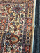 5' x 7' Rectangular Brown & Beige Floral Traditional Washable Area Rug close-up showing detailed floral border and finished edge.