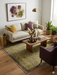 5' x 7' Rectangular Gold & Brown Textured Border Modern Area Rug styled in a contemporary living room.