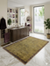 5' x 7' Rectangular Gold & Brown Textured Border Modern Area Rug styled in a luxurious contemporary bathroom.