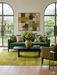 5' x 7' Rectangular Mustard Gold Distressed Medallion Traditional Washable Area Rug styled in a modern living room with a green velvet sofa and abstract wall art.