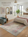 5' x 7' Rectangular Pink Gray Distressed Medallion Vintage Traditional Area Rug styled in a bedroom.