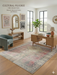 5' x 7' Rectangular Pink Gray Distressed Medallion Vintage Traditional Area Rug styled in a home office.