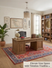 5' x 7' Rectangular Red & Blue Floral Traditional Area Rug styled in a classic home office with wooden desk and bookshelves.