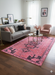 5' x 8' Rectangle Pink & Black Geometric Tribal Bohemian Area Rug placed in a modern living room setting.