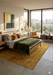 5' x 8' Rectangular Gold & Mustard Distressed Floral Traditional Washable Area Rug styled in a bedroom with warm wood furniture and desert-inspired decor.