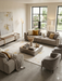 5' x 8' Rectangular Ivory & Gold Distressed Abstract Modern Washable Area Rug styled in a living room with soft neutral seating and contemporary accents.